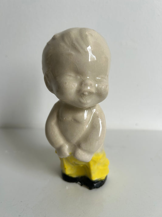 Kewpie estilo Vintage, amarillo con negro.